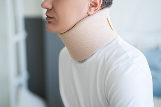 Man wearing a neck brace, orthopedic bandage, hernia of the cervical spine, health problems and pain concept