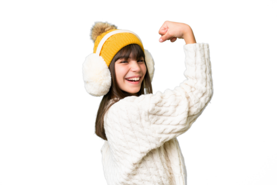 Little caucasian girl wearing winter muffs over isolated background doing strong gesture