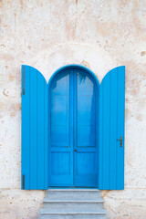 Blue Door with Blue Shutters on White Wall in Santa Maria di Leuca, Salento, Italy - 745113949