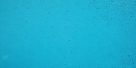 Obraz premium Blue light concrete texture for background in summer wallpaper. Cyan cement color sand wall