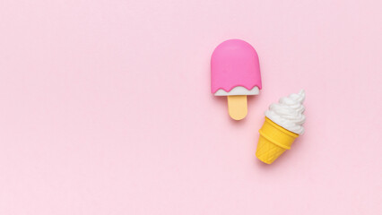 Plain and fruity ice cream on a pink background.