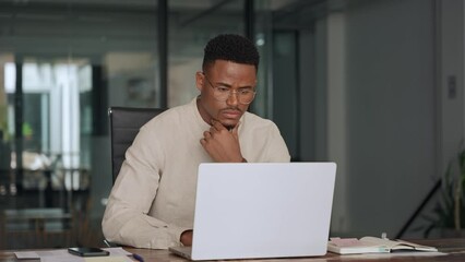 Busy professional African business man company employee, young male worker software developer businessman typing on computer technology using laptop working at office workplace desk. Vertical - Powered by Adobe