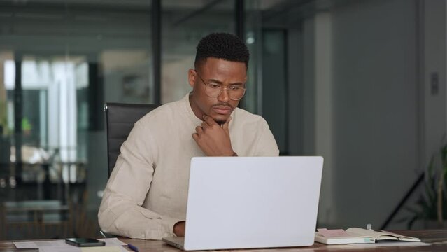 Busy professional African business man company employee, young male worker software developer businessman typing on computer technology using laptop working at office workplace desk. Vertical