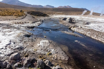 Tatio Geysers in San Pedro de Atacama, Chile, South America. Dramatic volcanic hot springs with rising water and steam
