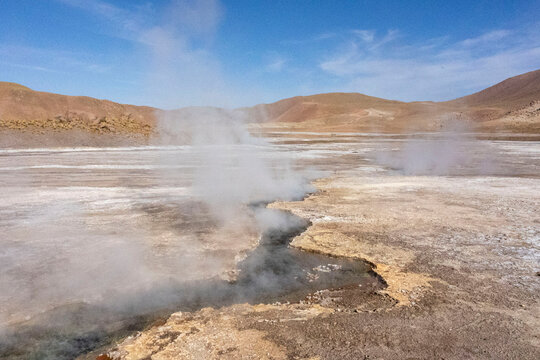 Tatio Geysers in San Pedro de Atacama, Chile, South America. Dramatic volcanic hot springs with rising water and steam © Zoe