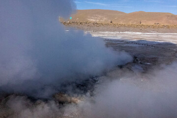 Tatio Geysers in San Pedro de Atacama, Chile, South America. Dramatic volcanic hot springs with rising water and steam