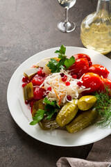 pickled cabbage cucumbers and tomatoes on plate - 745129365