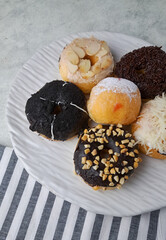 Various kinds of donuts which are children's favorite food. Isolated. Copy space. Menu. Flatlay. Food Photography