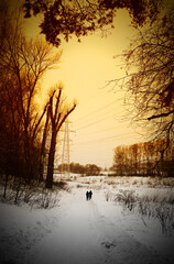 Couple walking in industrial park during last winter days background