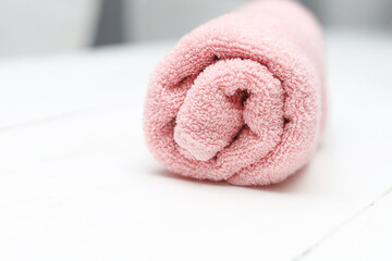Obraz na płótnie Canvas Pink cotton towel on white background.