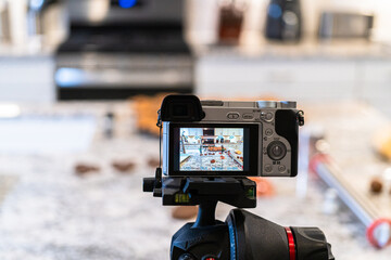 Recording Video with DSLR Camera in Modern Kitchen