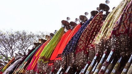 Multi colored decorated parasols kept for festival use