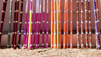 Multi colored decorated parasols kept for festival use