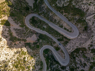 Mallorca, aerial drone photo of the road serpnetine in the mountains, Coll dels Reis