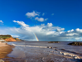 A rainbow over Sidmouth beach in Devon, UK.