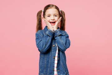 Little child surprised shocked cute kid girl 7-8 years old wearing denim shirt have fun look camera...
