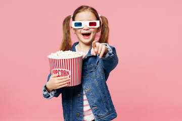 Little child surprised kid girl 7-8 year old wear denim shirt 3d glasses watch movie film hold...