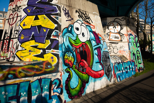 Charenton-le-Pont, France - January 10, 2021: Urban art and environment in Parisian suburbs. Funny graffiti on bridge over Marne river. Val-de-Marne, Ile-de-France, France