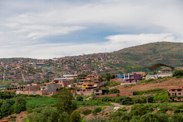 Fototapeta na wymiar neighbourhoods of houses built on a hill, underdevelopment in Latin America. Settlements 