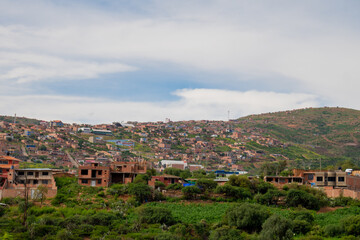 neighbourhoods of houses built on a hill, underdevelopment in Latin America. Settlements 