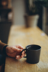person holding a cup of coffee