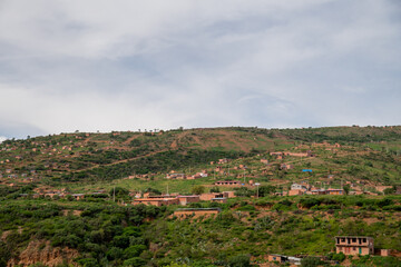 Fototapeta na wymiar neighbourhoods of houses built on a hill, underdevelopment in Latin America. Settlements 