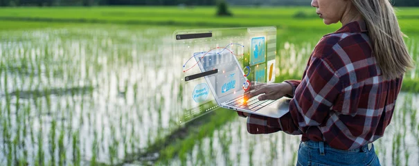 Fotobehang Ai for farming. iot Agriculture technology farmer woman holding tablet or tablet technology to research about agriculture problems analysis data and visual icon. © Rawat