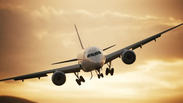Airplane landing at sunset. Passenger plane extends landing gear for landing. Passenger plane landing