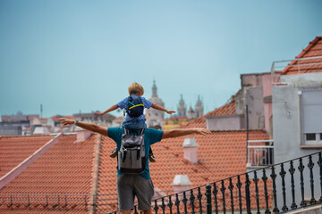 Father and son enjoy summer in Lisbon do sightseeing - 745184116