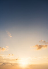 Sunset sky clouds vertical in the evening on golden hour sundown or orange sunrise in the morning,...