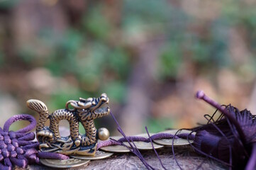 A figurine of a Chinese dragon with Chinese coins. Horoscope and feng shui.