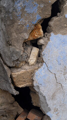 A large gap in the wall. A wall with a gap