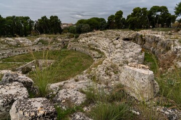 view of the ruins of the historic Roman amphitheater in Syracuse
