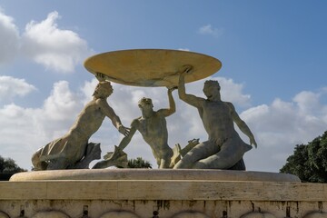 view of the Triton Fountain in downtown Valletta with the water turned off to save and conserve...