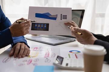 Business people meeting in a business presentation or seminar, documents, graphs and financial or...