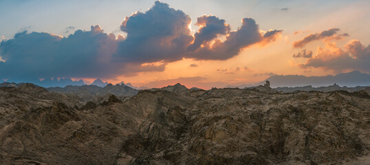 Dramatic wide Sunset panorama over Red Sea Hills mountain chain and Sahara desert. Sun already...