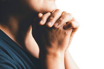 Close up woman believes in god, person hands praying on isolated white background. Asian woman stands in meditative pose, holds hands in praying gesture, has sense of inner peace, Religion concept. - obrazy, fototapety, plakaty