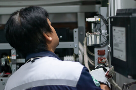 professional electrician checking power electrical system,preventive maintenance electricity in mdb room,technician service work mechanic at energy industry.