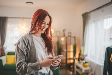 young woman at home use mobile phone sms texting or browse internet
