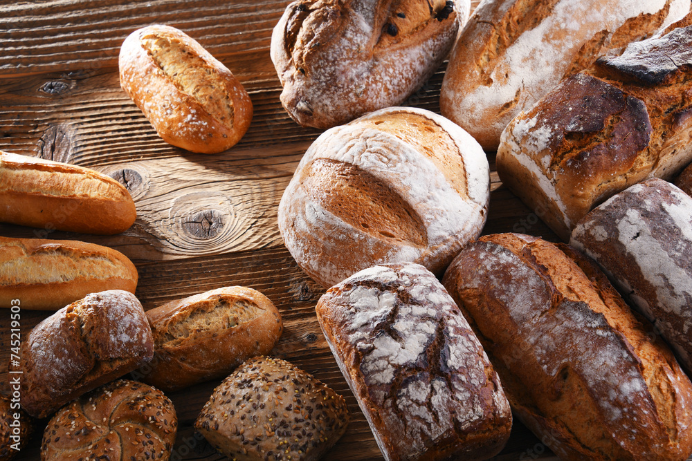 Wall mural composition with assorted bakery products on wooden table