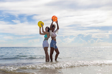 Woman on beach and sand during summer vacation. Beautiful girl on sun tanning in a tropical beach. Female tourist in bikini on sandy beach. Sexy bikini body woman on paradise tropical beach