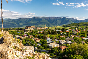 Landscape of Surami, small town (daba) in Georgia with ruins of old Soviet era soda factory and...