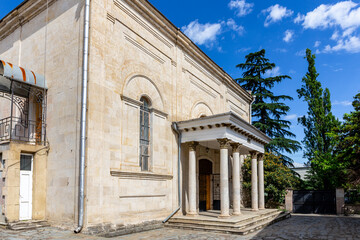 Fototapeta na wymiar Kutaisi Synagogue, old stone building from 1886 with white columns on Boris Gaponov Street.