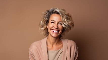 Close up of  mature woman with white skin, Bronze short hair wavy hair and a clear brown  t shirt, isolated in a light brown  studio. Portrait person. - obrazy, fototapety, plakaty