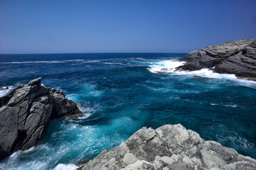 waves crashing on rocks, Shale cliffs at Capo Falcone. Stintino (SS), Sardinia. Italy