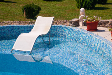 Sun lounger near the water pool - 745237304
