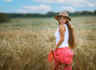 Happy Girl in a Wheat Field - 745237317
