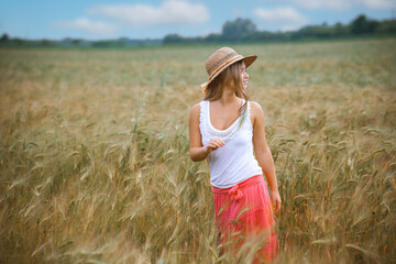 Happy Girl in a Wheat Field - 745237334