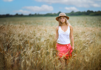 Happy Girl in a Wheat Field - 745237342