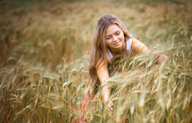 Happy Girl in a Wheat Field - 745237349